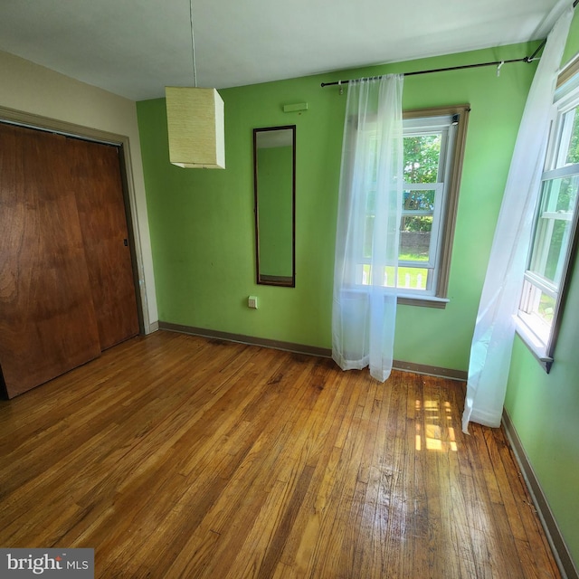 2102 Princeton Pike, Lawrence Township, NJ 08648 - unfurnished bedroom featuring hardwood / wood-style floors, baseboards, and a closet