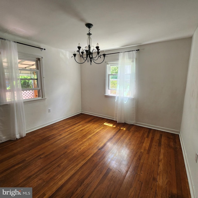 2102 Princeton Pike, Lawrence Township, NJ 08648 - unfurnished room with a chandelier, wood-type flooring, and baseboards