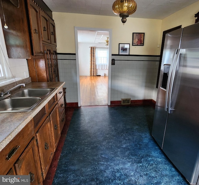 2102 Princeton Pike, Lawrence Township, NJ 08648 - kitchen featuring stainless steel refrigerator with ice dispenser, a sink, tile walls, a ceiling fan, and a wainscoted wall