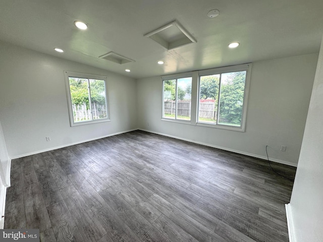 23 Karen Ct, New Castle, DE 19720 - unfurnished room with attic access, healthy amount of natural light, dark wood-style flooring, recessed lighting, and baseboards
