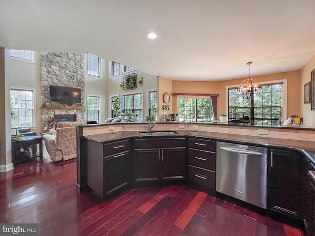 414 Saint James Ct, Langhorne, PA 19047 - kitchen featuring dishwasher, a sink, a fireplace, a chandelier, and dark wood-style floors