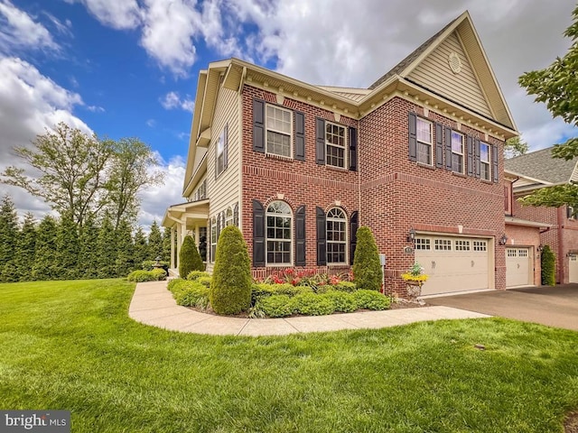 414 Saint James Ct, Langhorne, PA 19047 - view of front of home featuring a garage, brick siding, a front lawn, and driveway