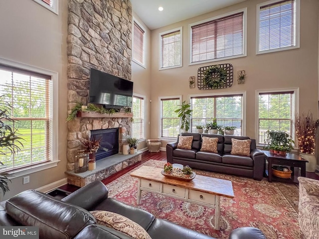 414 Saint James Ct, Langhorne, PA 19047 - living area featuring a high ceiling, a fireplace, wood finished floors, and baseboards