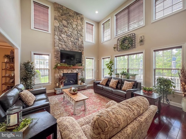 414 Saint James Ct, Langhorne, PA 19047 - living room featuring a high ceiling, baseboards, hardwood / wood-style floors, healthy amount of natural light, and a fireplace