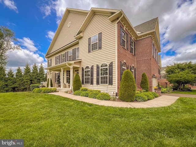 414 Saint James Ct, Langhorne, PA 19047 - rear view of house with a lawn, brick siding, and a porch