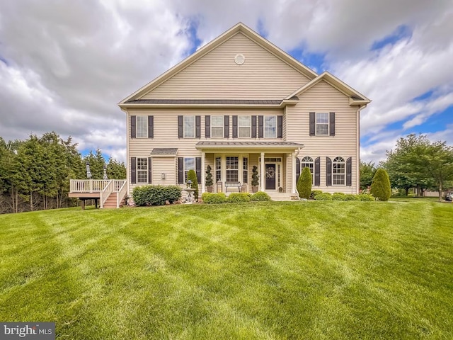 414 Saint James Ct, Langhorne, PA 19047 - back of property featuring a yard, metal roof, a standing seam roof, and a wooden deck