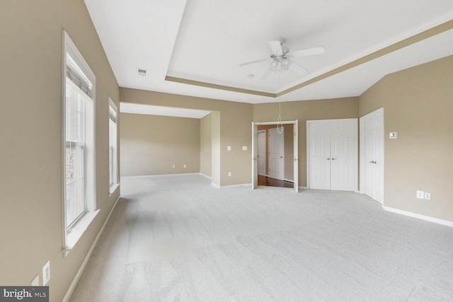 42435 Ibex Dr, Sterling, VA 20166 - unfurnished bedroom with a raised ceiling, multiple windows, light colored carpet, and baseboards