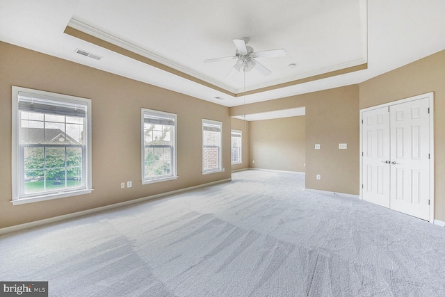 42435 Ibex Dr, Sterling, VA 20166 - unfurnished bedroom with a tray ceiling, carpet floors, ornamental molding, and multiple windows