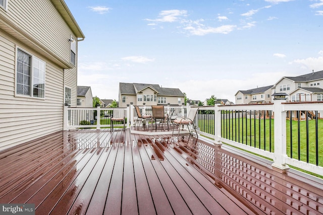 42435 Ibex Dr, Sterling, VA 20166 - wooden terrace with outdoor dining space, a residential view, and a lawn