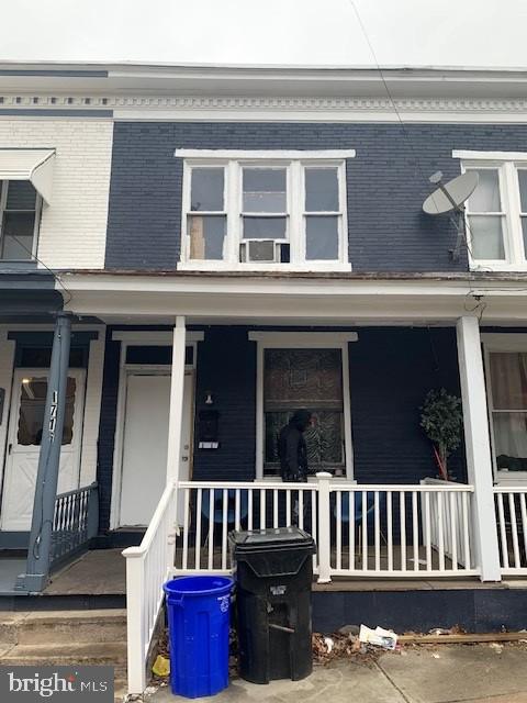 1716 Miller St, Harrisburg, PA 17103 - view of front of home with brick siding and a porch
