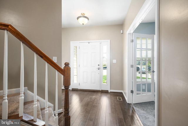 5194 Longbow Rd, King George, VA 22485 - entryway featuring dark wood-type flooring, stairway, and baseboards