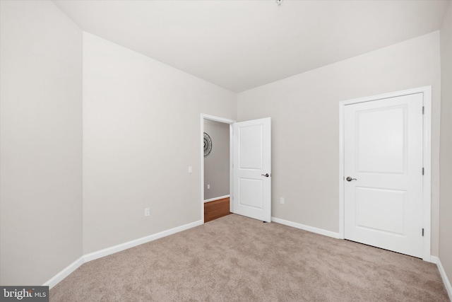 113 E Main St Unit 303, Newark, DE 19711 - unfurnished bedroom featuring carpet flooring