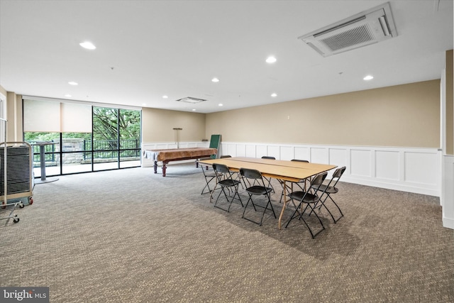 113 E Main St Unit 303, Newark, DE 19711 - carpeted dining room with wainscoting, recessed lighting, a decorative wall, and expansive windows