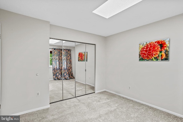 7533 Weather Worn Way Unit D, Columbia, MD 21046 - unfurnished bedroom featuring carpet floors, a skylight, and a closet