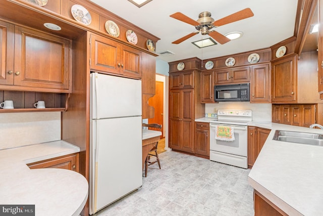 243 Park Ave, Mount Joy, PA 17552 - kitchen with white appliances, a sink, and light countertops