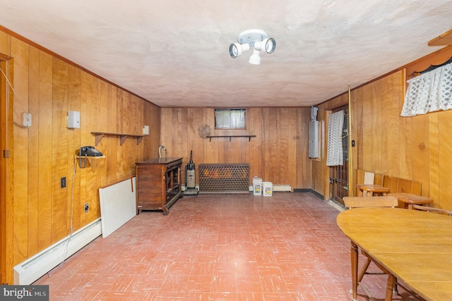 243 Park Ave, Mount Joy, PA 17552 - basement with a baseboard radiator, wooden walls, and electric panel