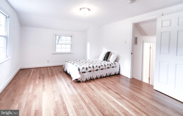 13908 Schaeffer Rd, Germantown, MD 20874 - bedroom with light wood-style floors, lofted ceiling, and baseboards
