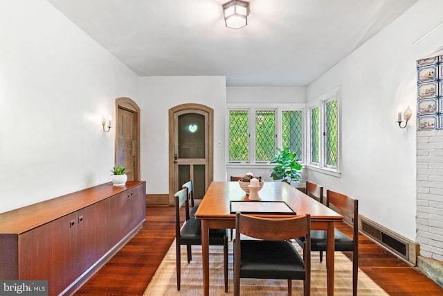 8515 Seminole St, Philadelphia, PA 19118 - dining space with wood finished floors, baseboards, and arched walkways