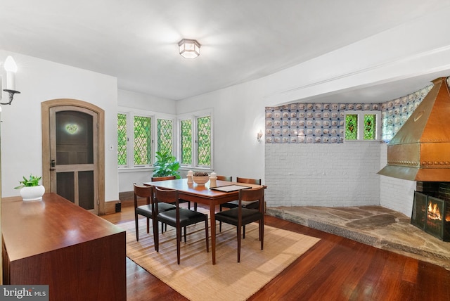 8515 Seminole St, Philadelphia, PA 19118 - dining area featuring wood finished floors and a warm lit fireplace