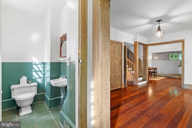 8515 Seminole St, Philadelphia, PA 19118 - bathroom featuring toilet, baseboards, and wood finished floors