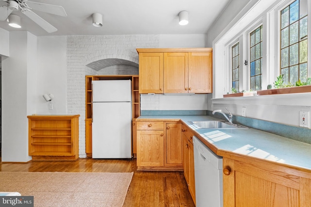 8515 Seminole St, Philadelphia, PA 19118 - kitchen with white appliances, a sink, wood finished floors, a ceiling fan, and light countertops