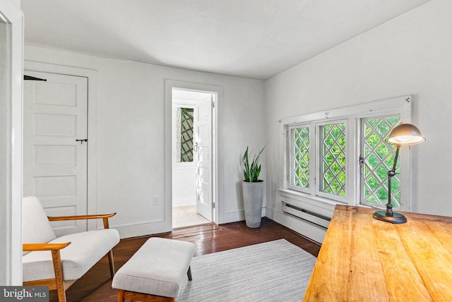 8515 Seminole St, Philadelphia, PA 19118 - living area with wood finished floors, a baseboard heating unit, and baseboards