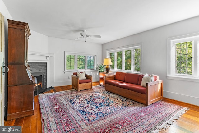 8515 Seminole St, Philadelphia, PA 19118 - living room with a ceiling fan, wood finished floors, a fireplace with flush hearth, and baseboards