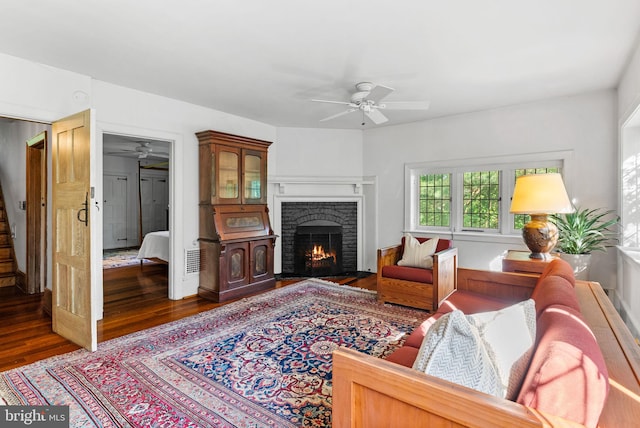 8515 Seminole St, Philadelphia, PA 19118 - living area featuring ceiling fan, wood finished floors, stairs, and a brick fireplace