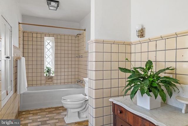 8515 Seminole St, Philadelphia, PA 19118 - full bathroom featuring tile walls, shower / bathtub combination, toilet, vanity, and wainscoting