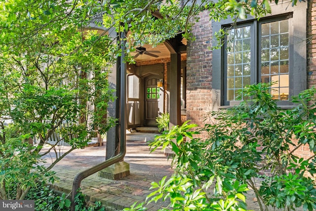 8515 Seminole St, Philadelphia, PA 19118 - view of exterior entry with a ceiling fan and brick siding