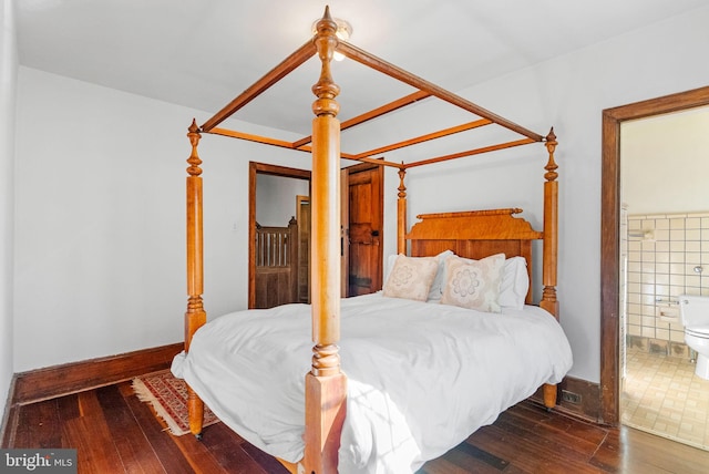 8515 Seminole St, Philadelphia, PA 19118 - bedroom featuring hardwood / wood-style flooring, connected bathroom, and baseboards