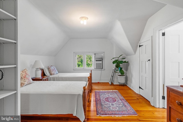 8515 Seminole St, Philadelphia, PA 19118 - bedroom with light wood-style flooring, vaulted ceiling, and cooling unit