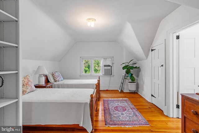 8515 Seminole St, Philadelphia, PA 19118 - bedroom with light wood-style floors, vaulted ceiling, and cooling unit