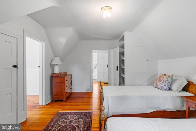 8515 Seminole St, Philadelphia, PA 19118 - bedroom featuring vaulted ceiling and light wood-style flooring
