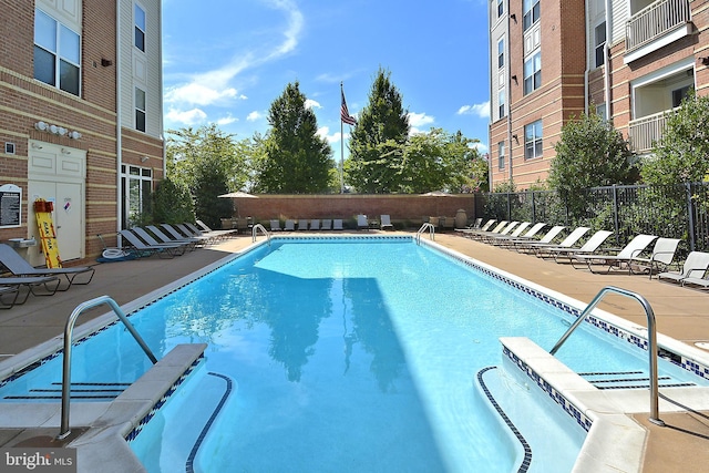 9486 Virginia Center Blvd Unit 316, Vienna, VA 22181 - community pool featuring a patio