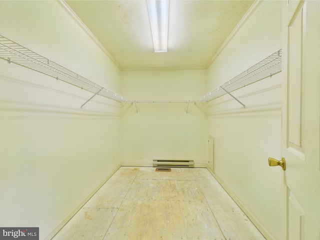423 W Market St, Georgetown, DE 19947 - walk in closet featuring a baseboard radiator