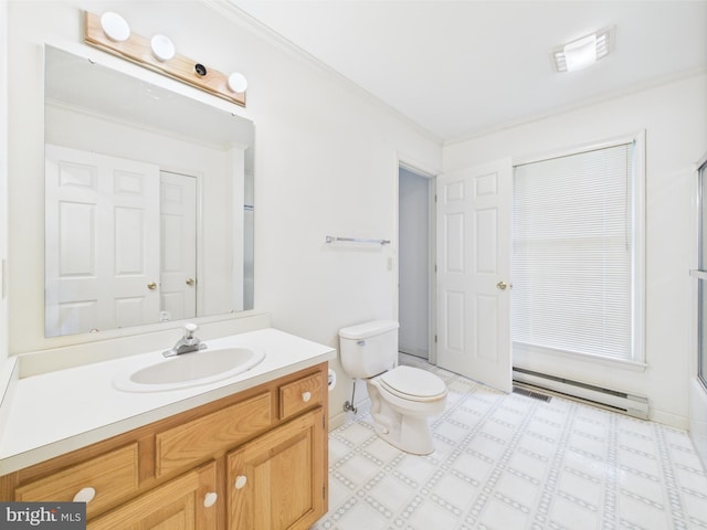 423 W Market St, Georgetown, DE 19947 - bathroom with a baseboard heating unit, vanity, toilet, ornamental molding, and a shower with door