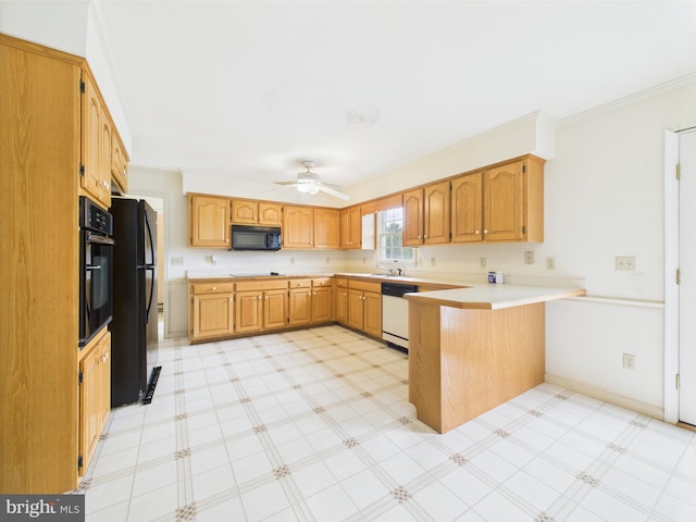 423 W Market St, Georgetown, DE 19947 - kitchen featuring black appliances, a peninsula, light countertops, ornamental molding, and ceiling fan