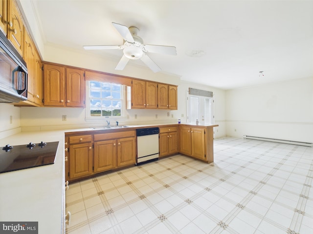 423 W Market St, Georgetown, DE 19947 - kitchen featuring white dishwasher, stainless steel microwave, a baseboard radiator, black electric stovetop, and a sink