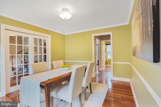 6034 Burnside Landing Dr, Burke, VA 22015 - dining space with wood finished floors, french doors, ornamental molding, and baseboards