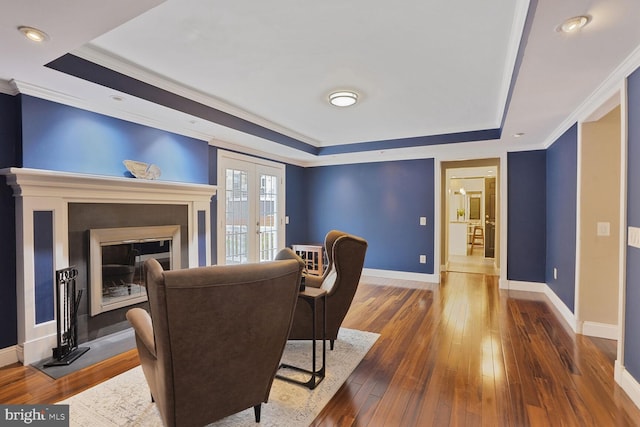 6034 Burnside Landing Dr, Burke, VA 22015 - living room featuring a raised ceiling, baseboards, french doors, crown molding, and wood finished floors