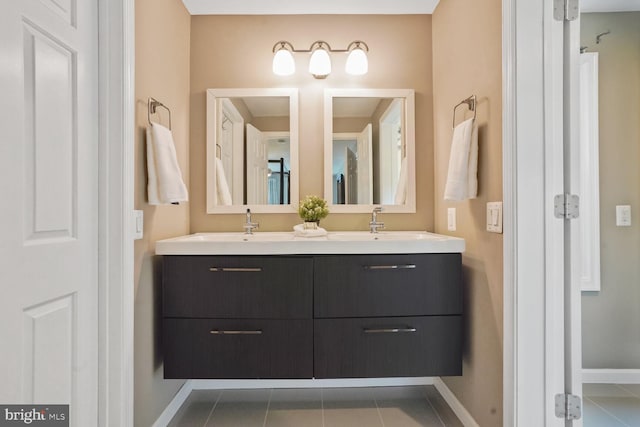 6034 Burnside Landing Dr, Burke, VA 22015 - full bath with baseboards, double vanity, and tile patterned floors