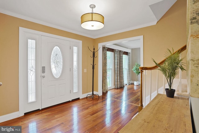 6034 Burnside Landing Dr, Burke, VA 22015 - entrance foyer with healthy amount of natural light, hardwood / wood-style flooring, crown molding, and baseboards