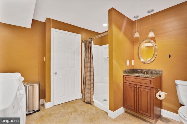 6034 Burnside Landing Dr, Burke, VA 22015 - full bath with toilet, a stall shower, washer and dryer, baseboards, and vanity