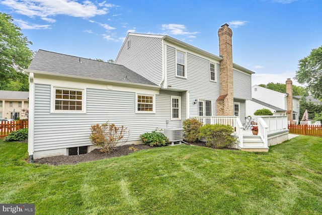 6034 Burnside Landing Dr, Burke, VA 22015 - back of property with cooling unit, a wooden deck, and a chimney