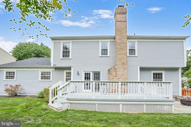 6034 Burnside Landing Dr, Burke, VA 22015 - rear view of property with a chimney, a yard, and a deck