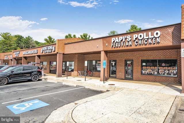6034 Burnside Landing Dr, Burke, VA 22015 - view of commercial property featuring uncovered parking
