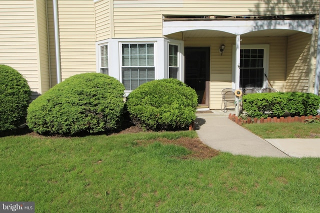 29 Huber Ct, Hightstown, NJ 08520 - view of exterior entry with a yard
