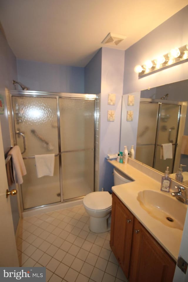 29 Huber Ct, Hightstown, NJ 08520 - bathroom featuring tile patterned flooring, a shower stall, vanity, and toilet