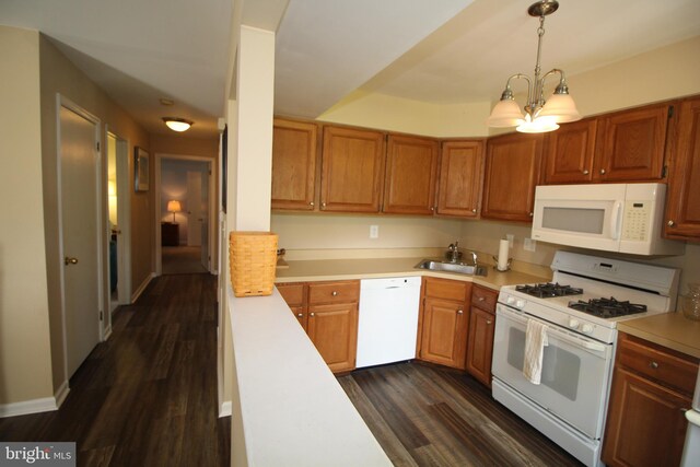 29 Huber Ct, Hightstown, NJ 08520 - kitchen featuring white appliances, a sink, light countertops, dark wood finished floors, and brown cabinetry